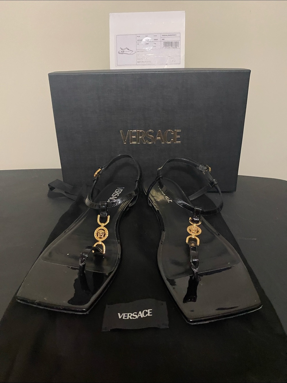 Versace Black Patent Leather T-Strap Sandals with Gold Medallion Accents
